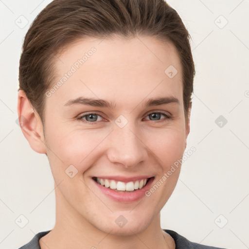 Joyful white young-adult female with short  brown hair and grey eyes