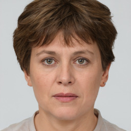 Joyful white adult female with short  brown hair and grey eyes