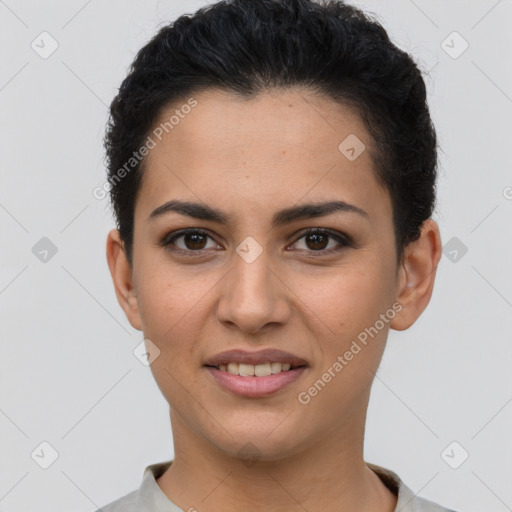 Joyful latino young-adult female with short  brown hair and brown eyes