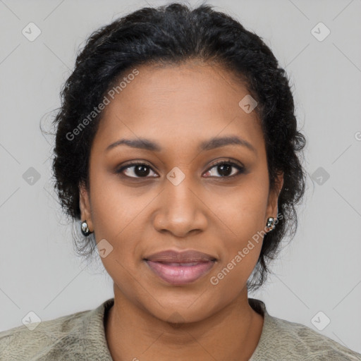 Joyful black young-adult female with short  black hair and brown eyes