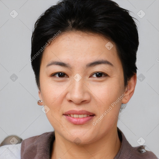 Joyful asian young-adult female with short  brown hair and brown eyes