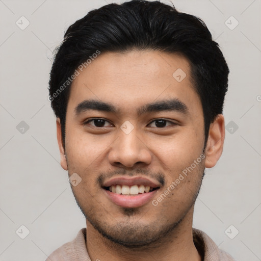 Joyful asian young-adult male with short  black hair and brown eyes