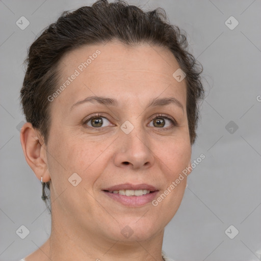 Joyful white adult female with short  brown hair and grey eyes