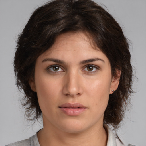 Neutral white young-adult female with medium  brown hair and brown eyes