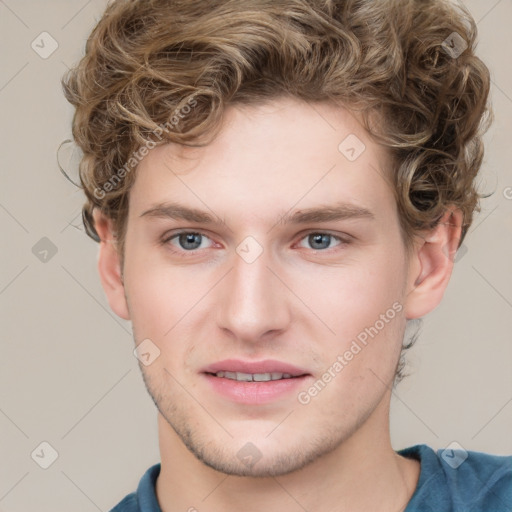 Joyful white young-adult male with short  brown hair and blue eyes