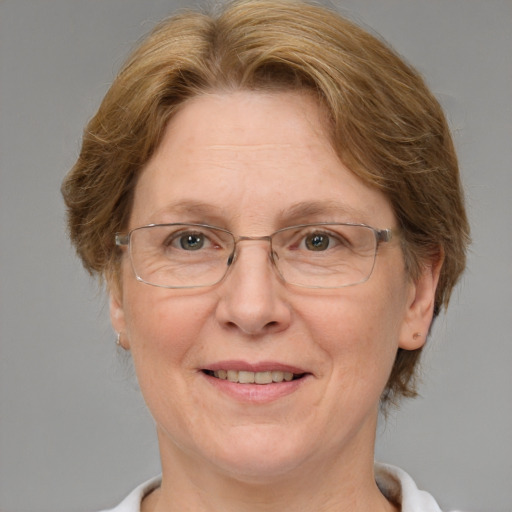 Joyful white middle-aged female with medium  brown hair and blue eyes