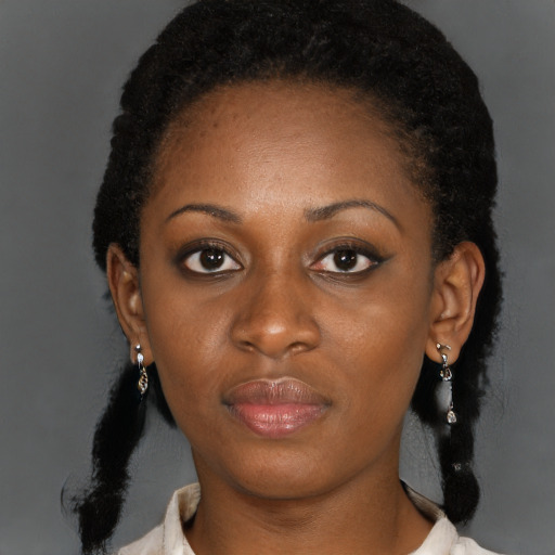 Neutral black young-adult female with medium  black hair and brown eyes