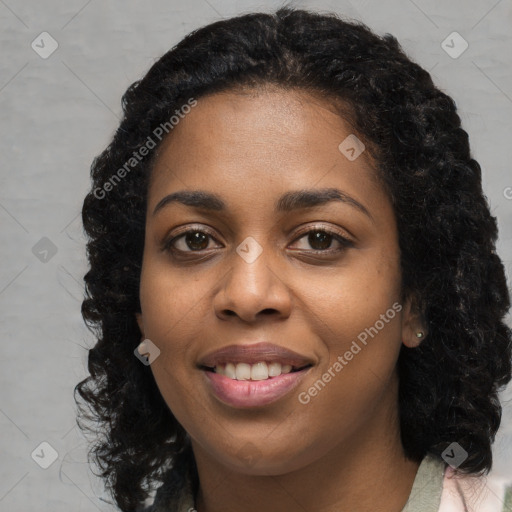 Joyful black young-adult female with long  black hair and brown eyes