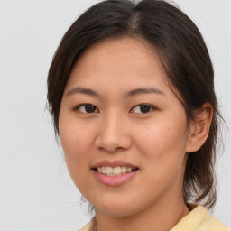 Joyful white young-adult female with medium  brown hair and brown eyes