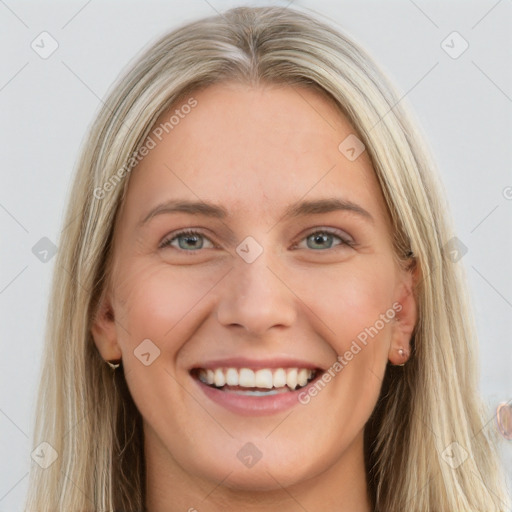 Joyful white young-adult female with long  brown hair and grey eyes