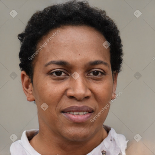 Joyful black adult female with short  brown hair and brown eyes