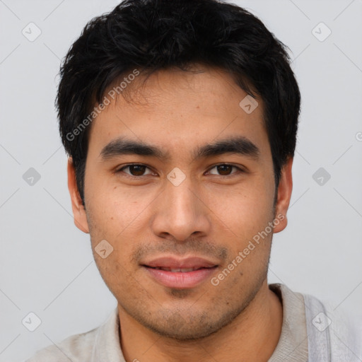 Joyful asian young-adult male with short  brown hair and brown eyes