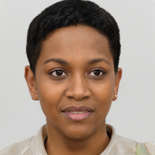 Joyful black young-adult female with short  black hair and brown eyes