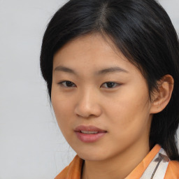 Neutral asian young-adult female with medium  brown hair and brown eyes