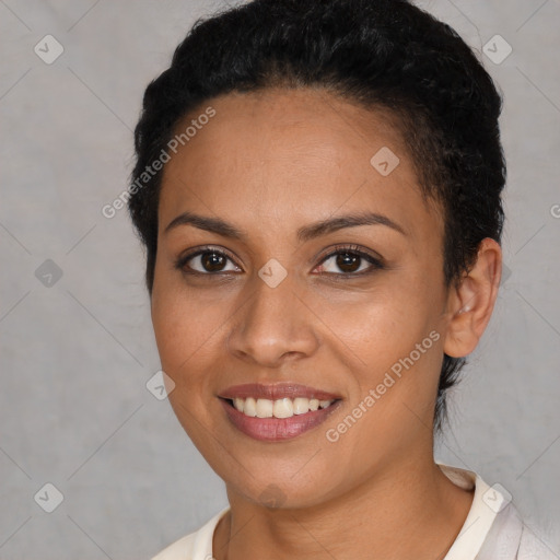 Joyful latino young-adult female with short  brown hair and brown eyes