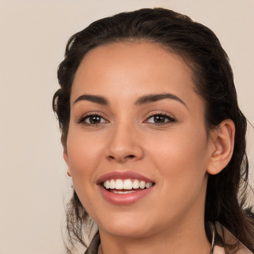 Joyful white young-adult female with long  brown hair and brown eyes