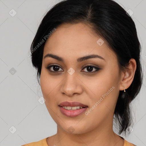 Joyful latino young-adult female with medium  brown hair and brown eyes