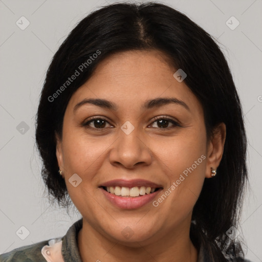 Joyful latino young-adult female with medium  brown hair and brown eyes