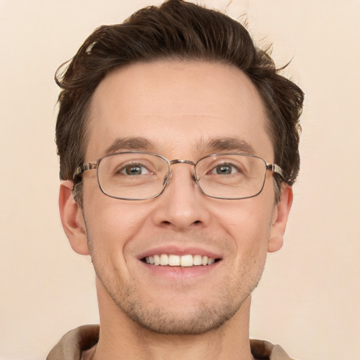 Joyful white adult male with short  brown hair and grey eyes