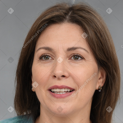 Joyful white adult female with medium  brown hair and brown eyes