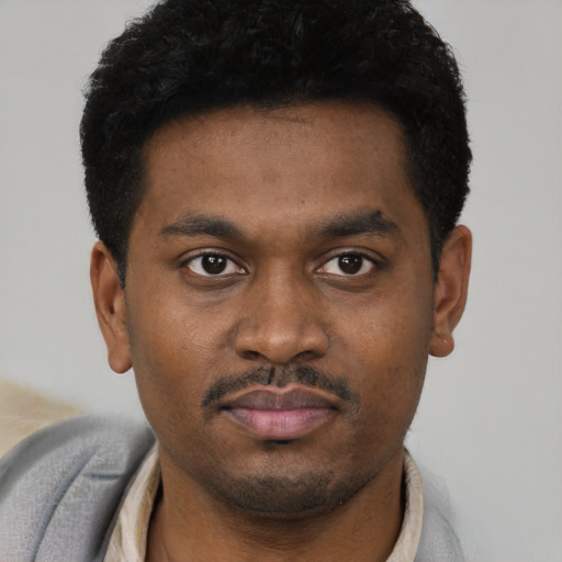 Neutral black young-adult male with short  brown hair and brown eyes