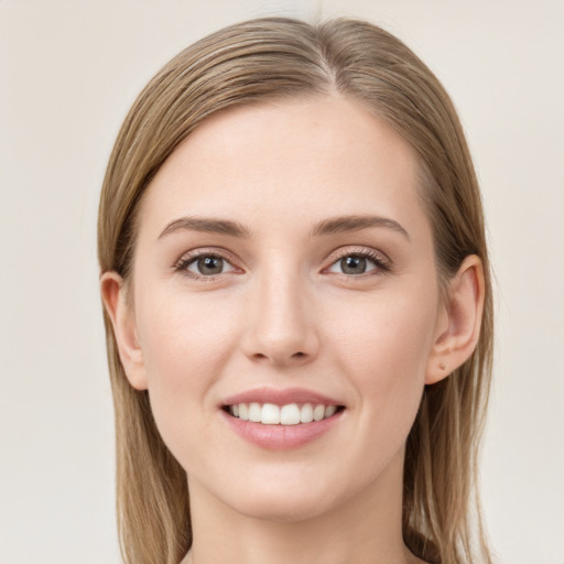 Joyful white young-adult female with long  brown hair and grey eyes