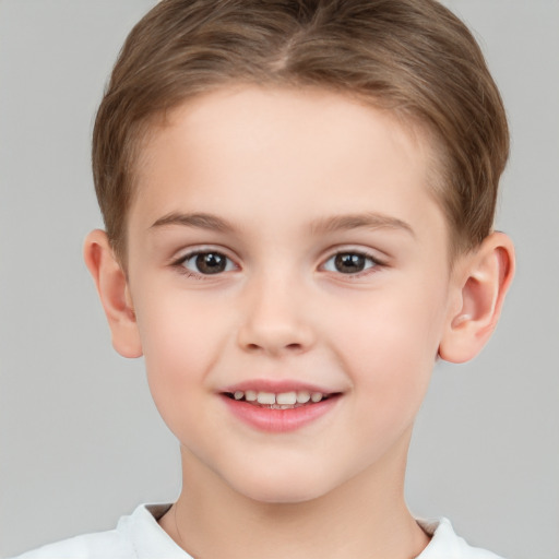 Joyful white child female with short  brown hair and brown eyes