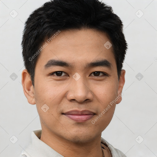 Joyful asian young-adult male with short  black hair and brown eyes