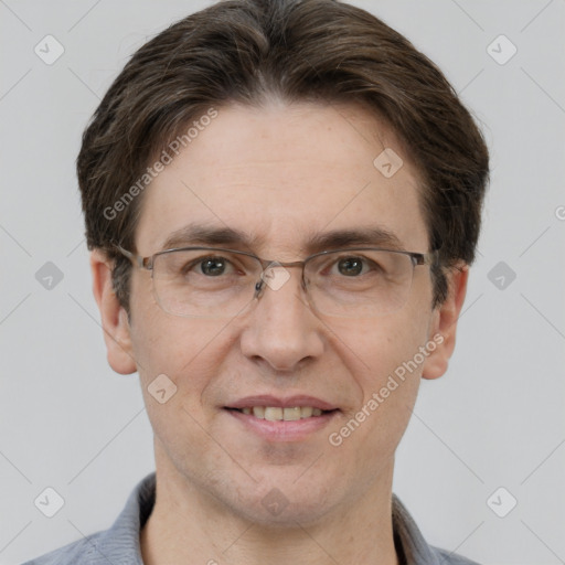 Joyful white adult male with short  brown hair and grey eyes