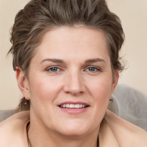 Joyful white young-adult female with medium  brown hair and grey eyes