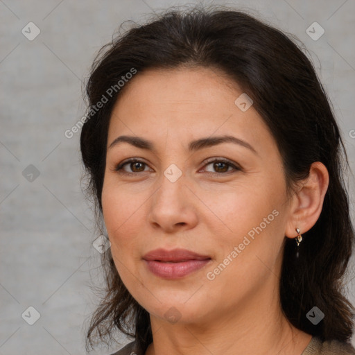 Joyful white adult female with medium  brown hair and brown eyes