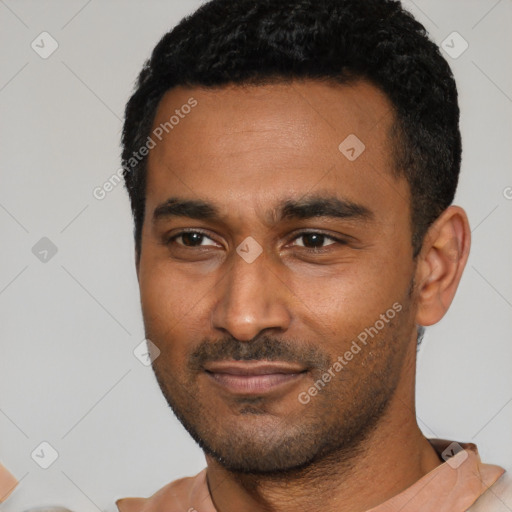 Joyful latino young-adult male with short  black hair and brown eyes