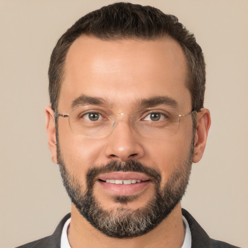 Joyful white adult male with short  brown hair and brown eyes