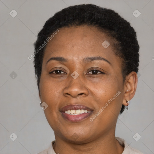 Joyful latino adult female with short  brown hair and brown eyes