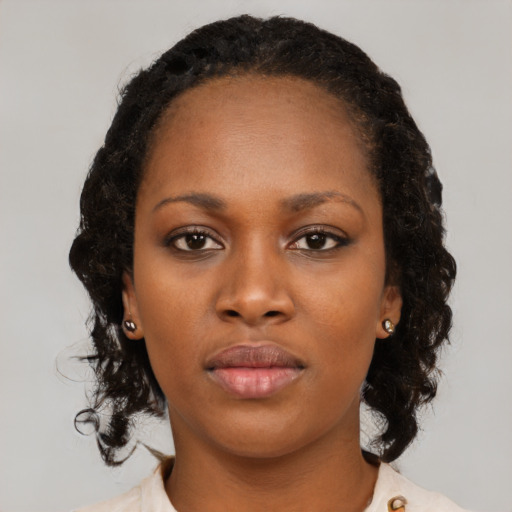 Neutral black young-adult female with medium  black hair and brown eyes