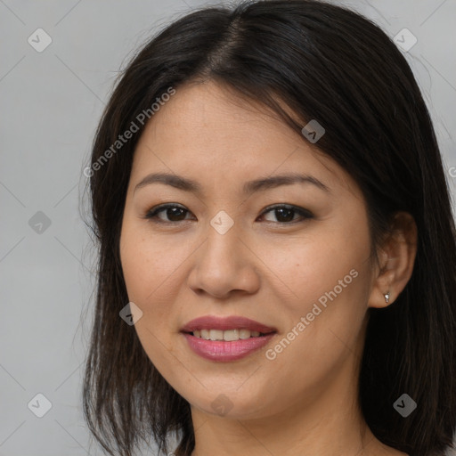 Joyful asian young-adult female with long  brown hair and brown eyes