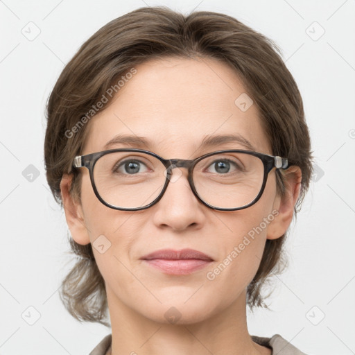 Joyful white adult female with medium  brown hair and grey eyes