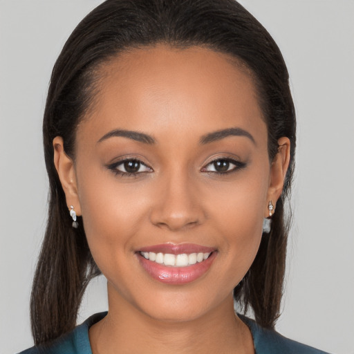 Joyful white young-adult female with long  brown hair and brown eyes