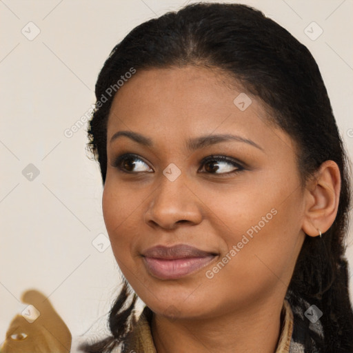 Joyful black young-adult female with medium  brown hair and brown eyes