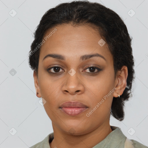 Joyful black adult female with short  brown hair and brown eyes