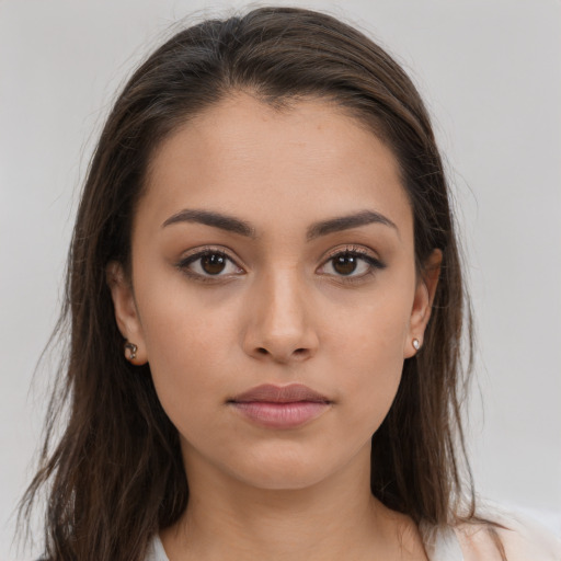 Neutral white young-adult female with long  brown hair and brown eyes