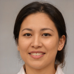 Joyful asian young-adult female with medium  brown hair and brown eyes