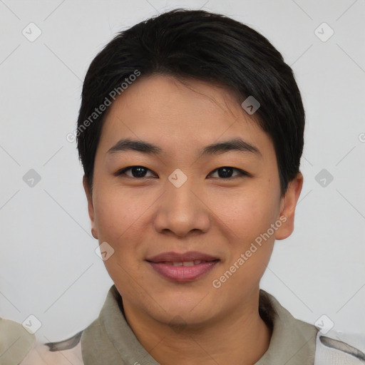 Joyful asian young-adult female with short  black hair and brown eyes