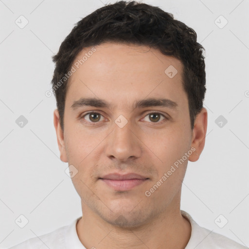 Neutral white young-adult male with short  black hair and brown eyes