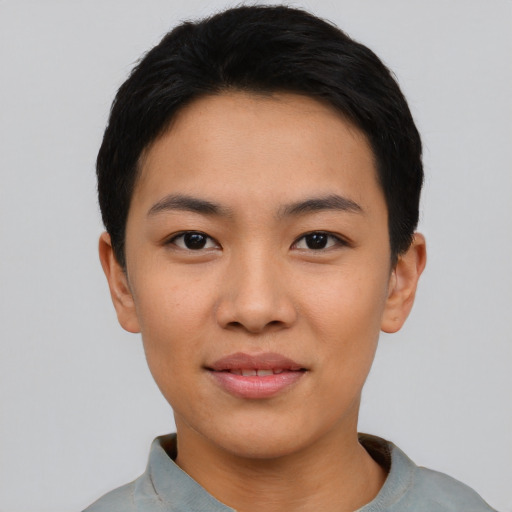 Joyful asian young-adult female with short  black hair and brown eyes