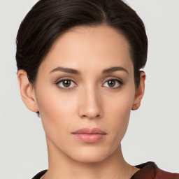 Neutral white young-adult female with short  brown hair and brown eyes