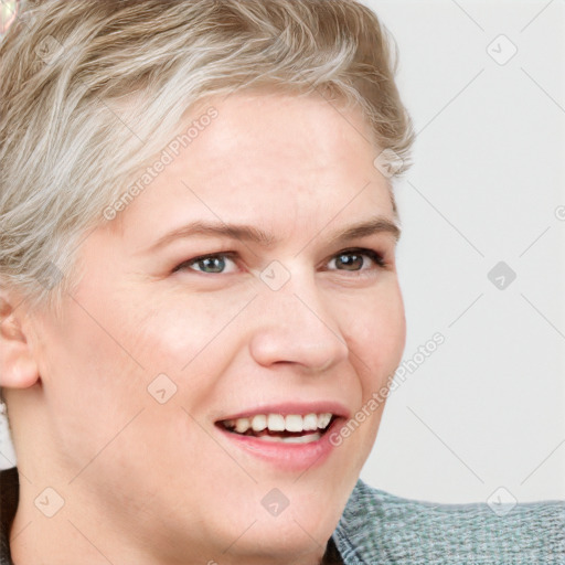 Joyful white young-adult female with medium  brown hair and blue eyes