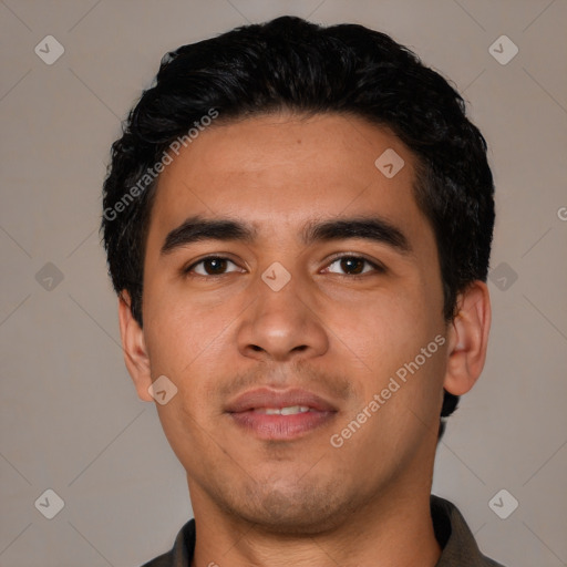 Joyful latino young-adult male with short  black hair and brown eyes