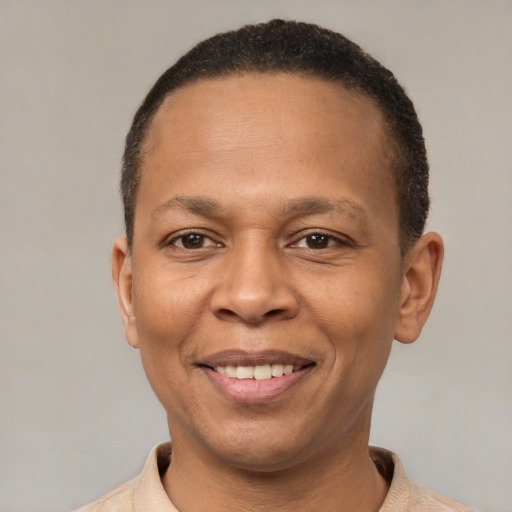 Joyful latino adult male with short  brown hair and brown eyes