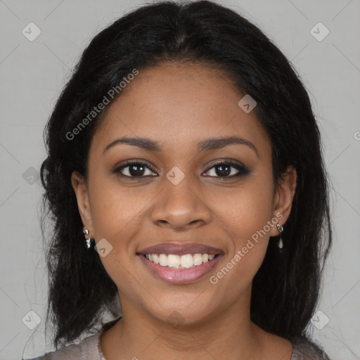 Joyful black young-adult female with long  brown hair and brown eyes